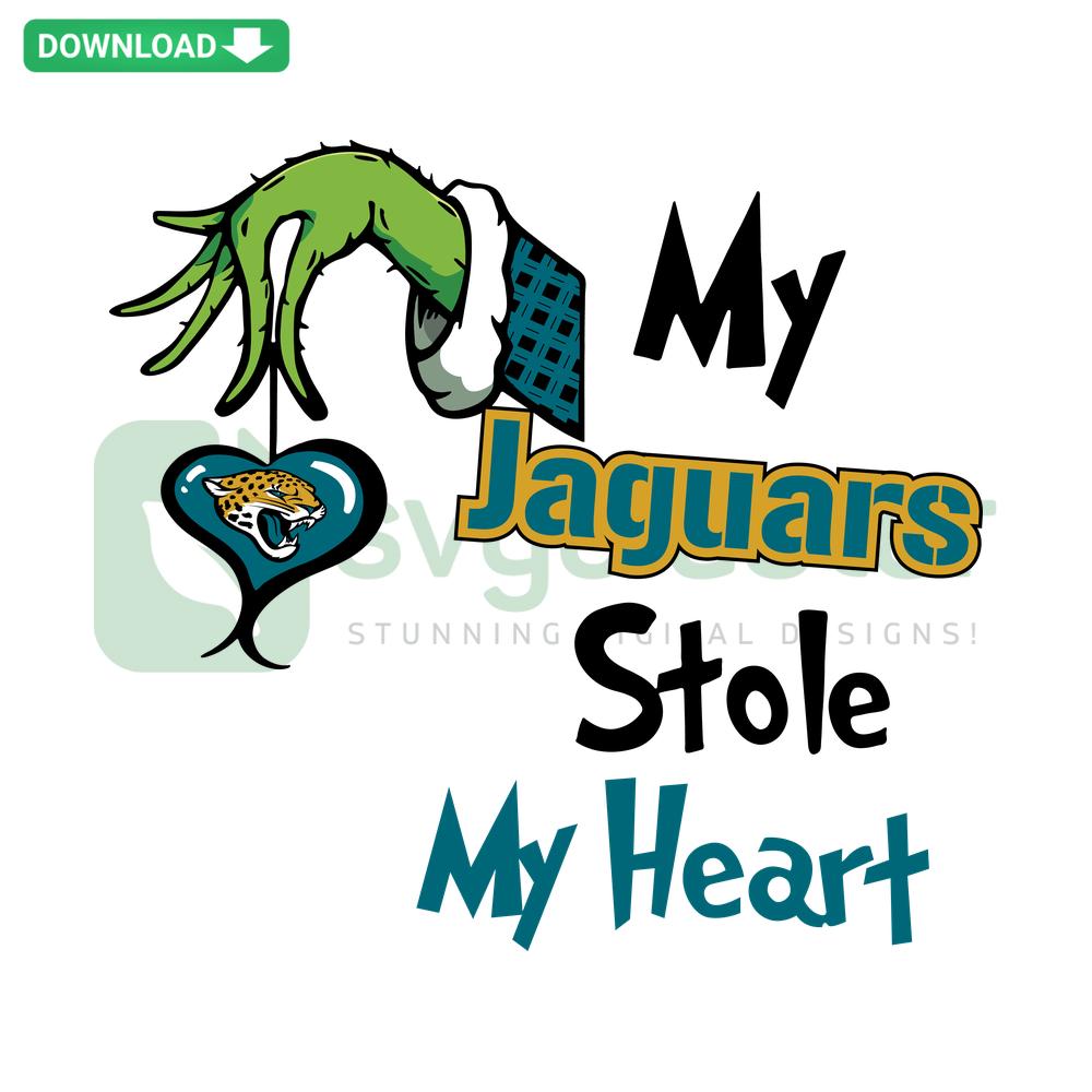 Grinch hand holding a Jaguars heart-shaped ornament, SVG design for sports lovers, perfect for designers' holiday projects.